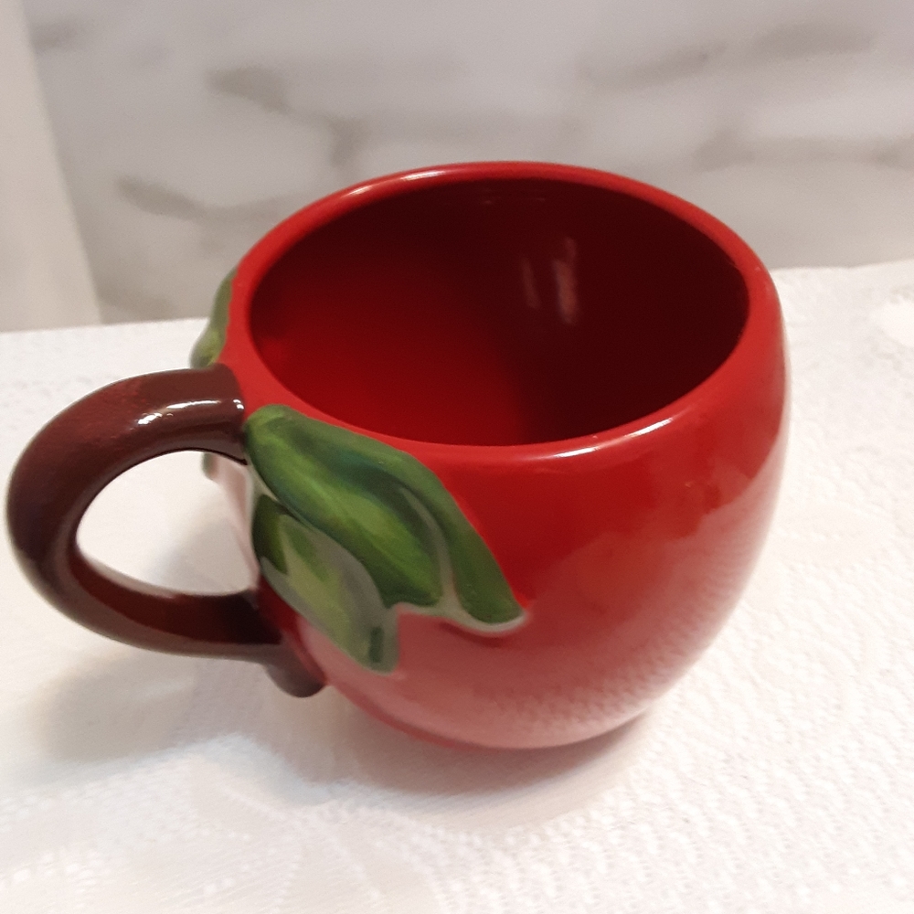 Mug for coffee tea soup. Red apple